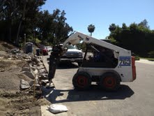 Using a Jackhammer on our Bobcat