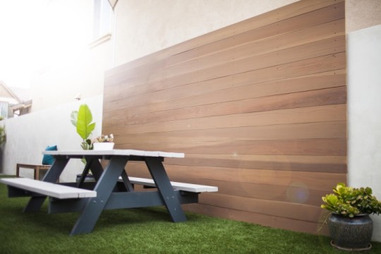 Bench and decorative wood fence wall