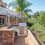 Grilling in an outdoor kitchen is a lot more fun